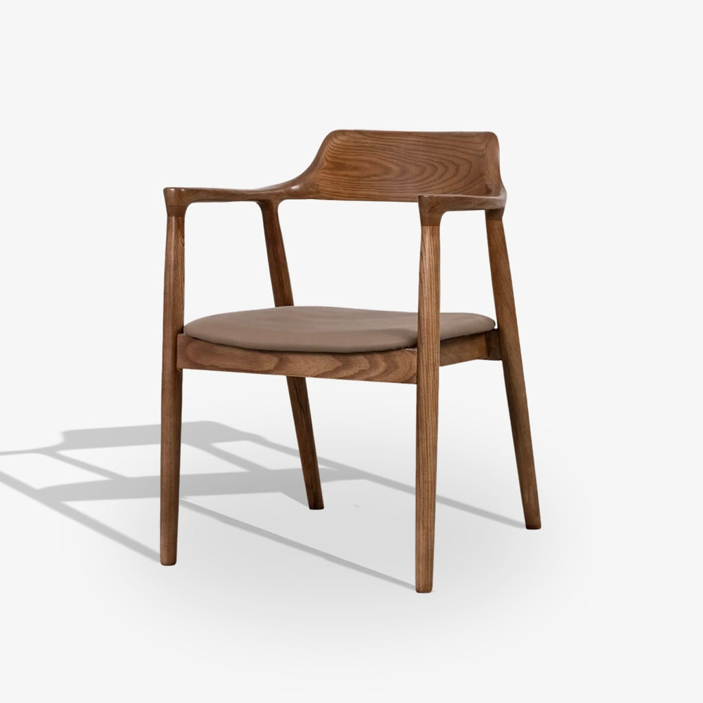 Wooden chair with a brown cushion on a white background