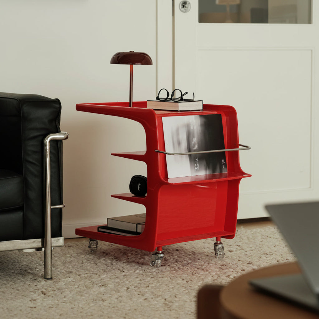 Red side table with shelves in a room setting